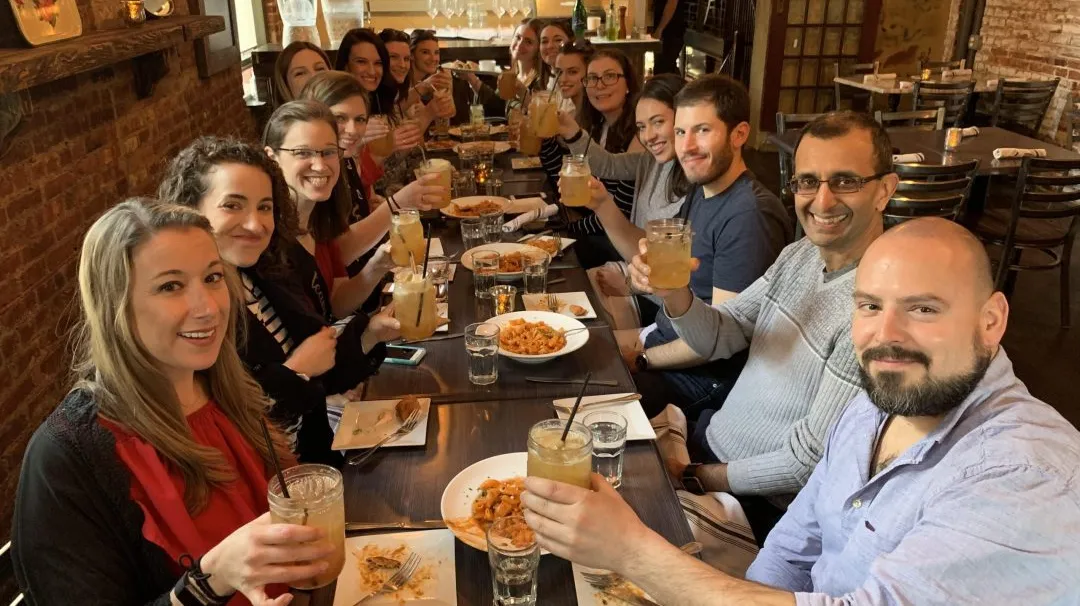 BTP_Slider_01-scaled a group of people eating food at a restaurant