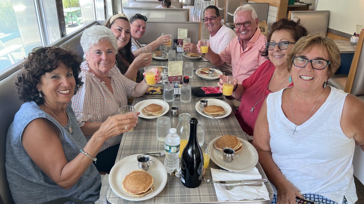 IMG_3391 a group of people sitting at a table