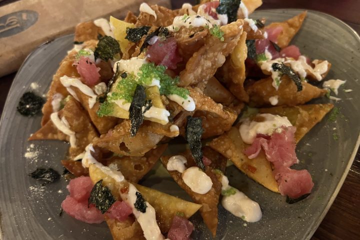 a plate of food on a wooden table