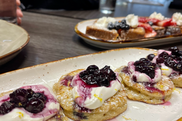 a pizza sitting on top of a wooden table