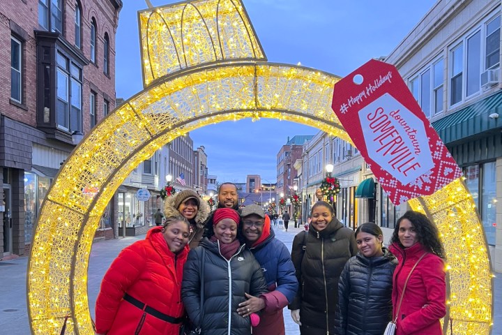 Patricia Kaliati et al. standing in front of a building