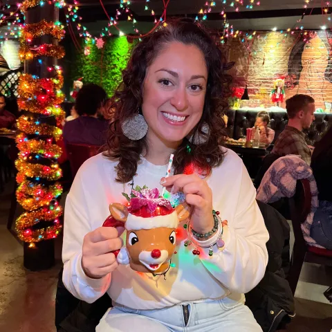 a person holding a cake