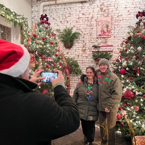 Ela Thier et al. standing in front of a building