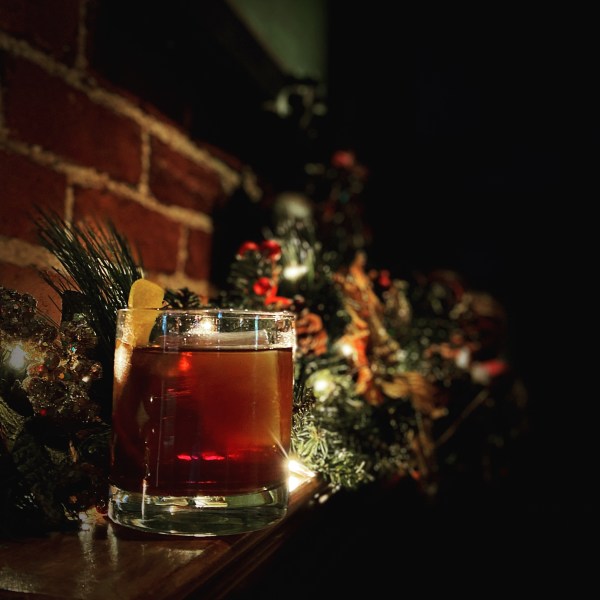a close up of a glass of beer on a table