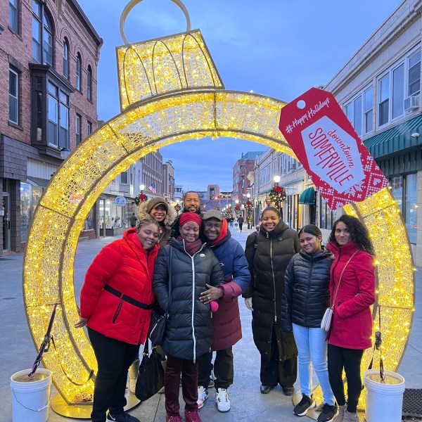 a group of people standing in front of a building