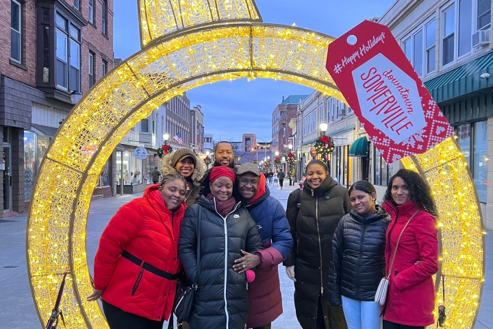 a group of people standing in front of a building