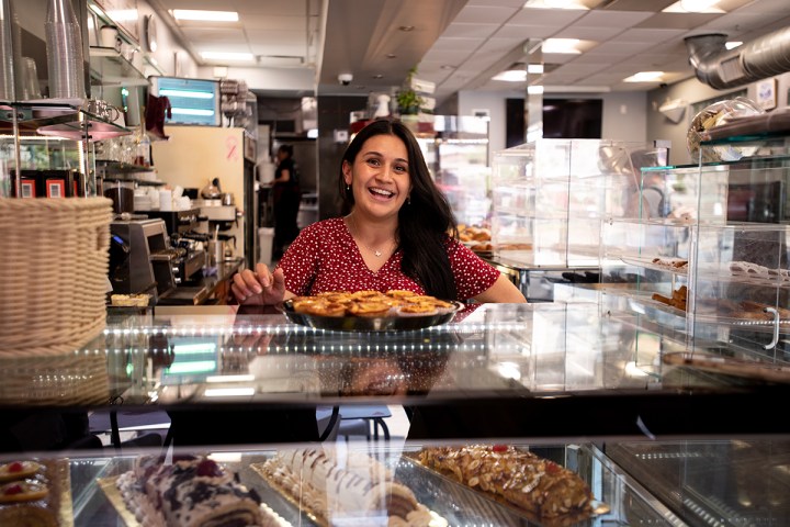 a woman standing in front of a store
