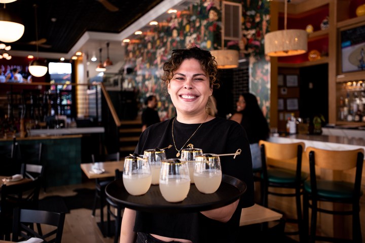 a person sitting at a table in a restaurant